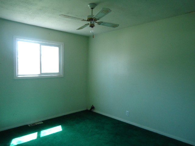 550 Redwood Road Bolingbrook, IL 60440 - Photo 5 of 14 an empty room with a window and a fan