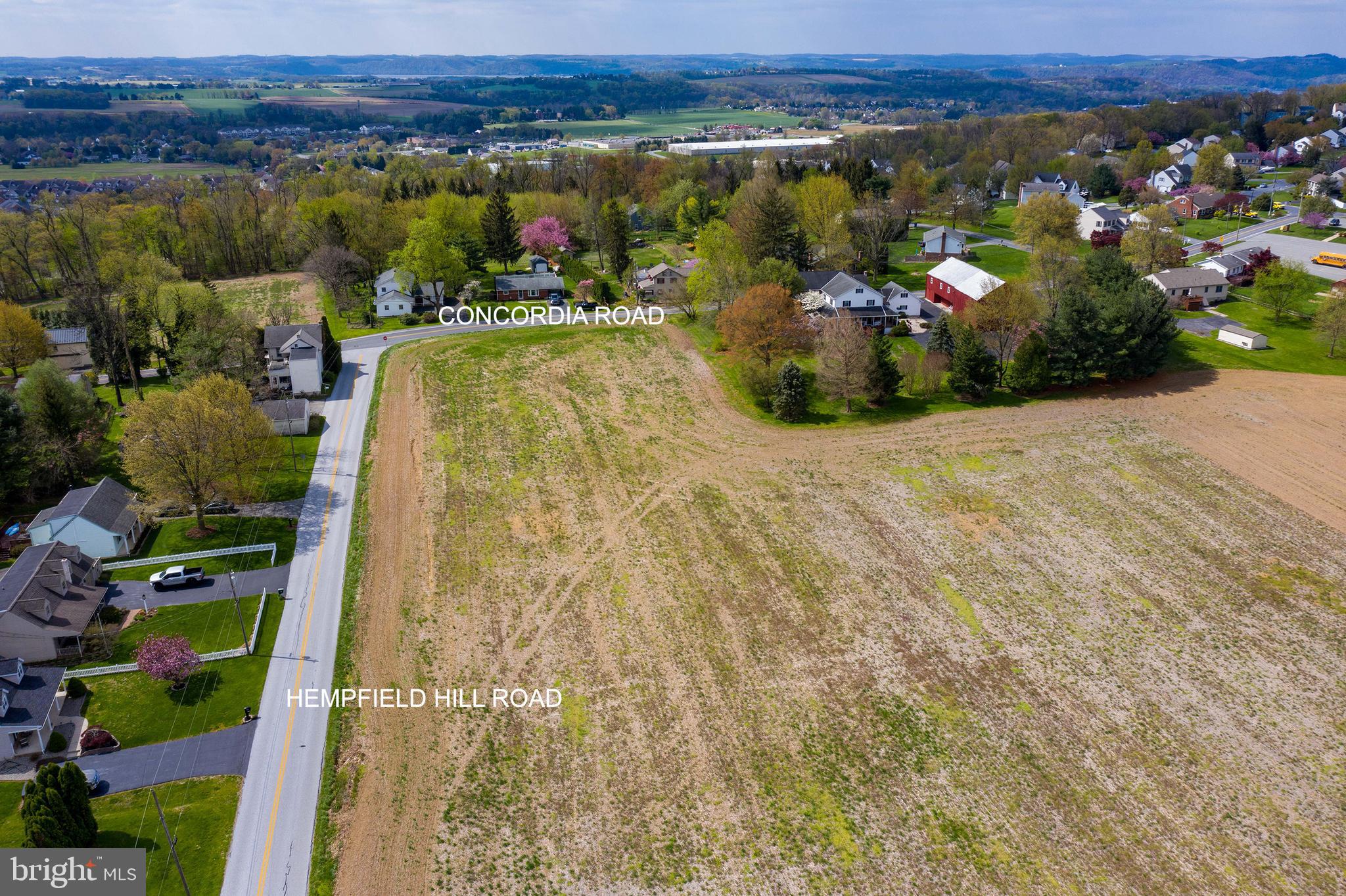 419 Hempfield Hill Road, Unit LOT # 7 Columbia, PA 17512 - Photo 11 of 13 an aerial view of a house with a yard and lake view