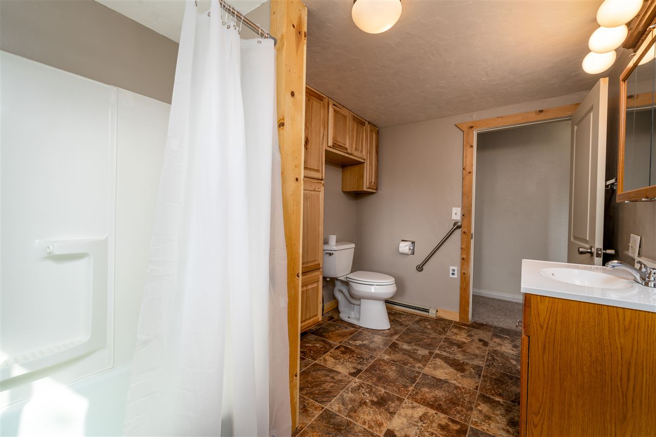 2052 I Road Fruita, CO 81521 - Photo 19 of 31 a bathroom with a toilet sink and mirror