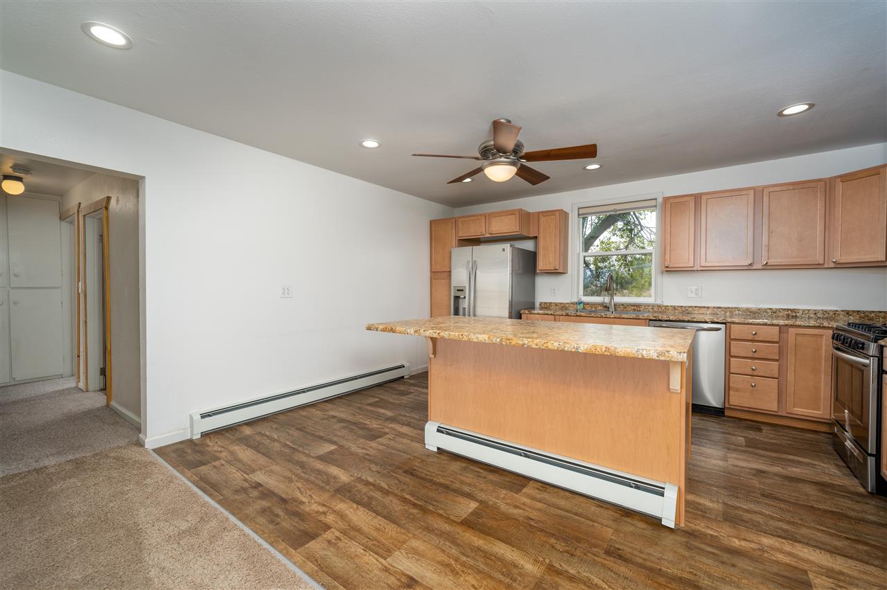 2052 I Road Fruita, CO 81521 - Photo 20 of 31 a living room with granite countertop furniture a sink a window and stainless steel appliances