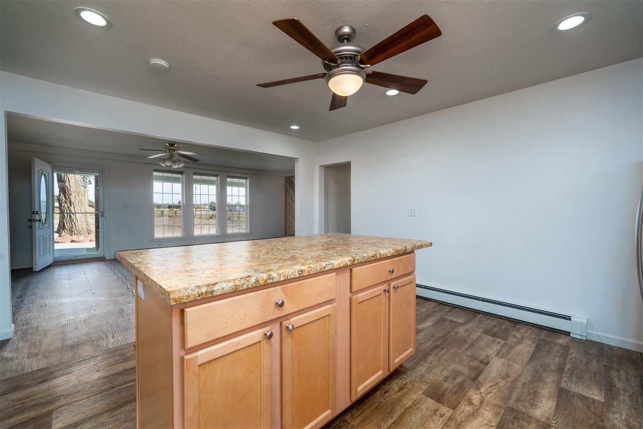 2052 I Road Fruita, CO 81521 - Photo 21 of 31 an empty room with wooden floor and window