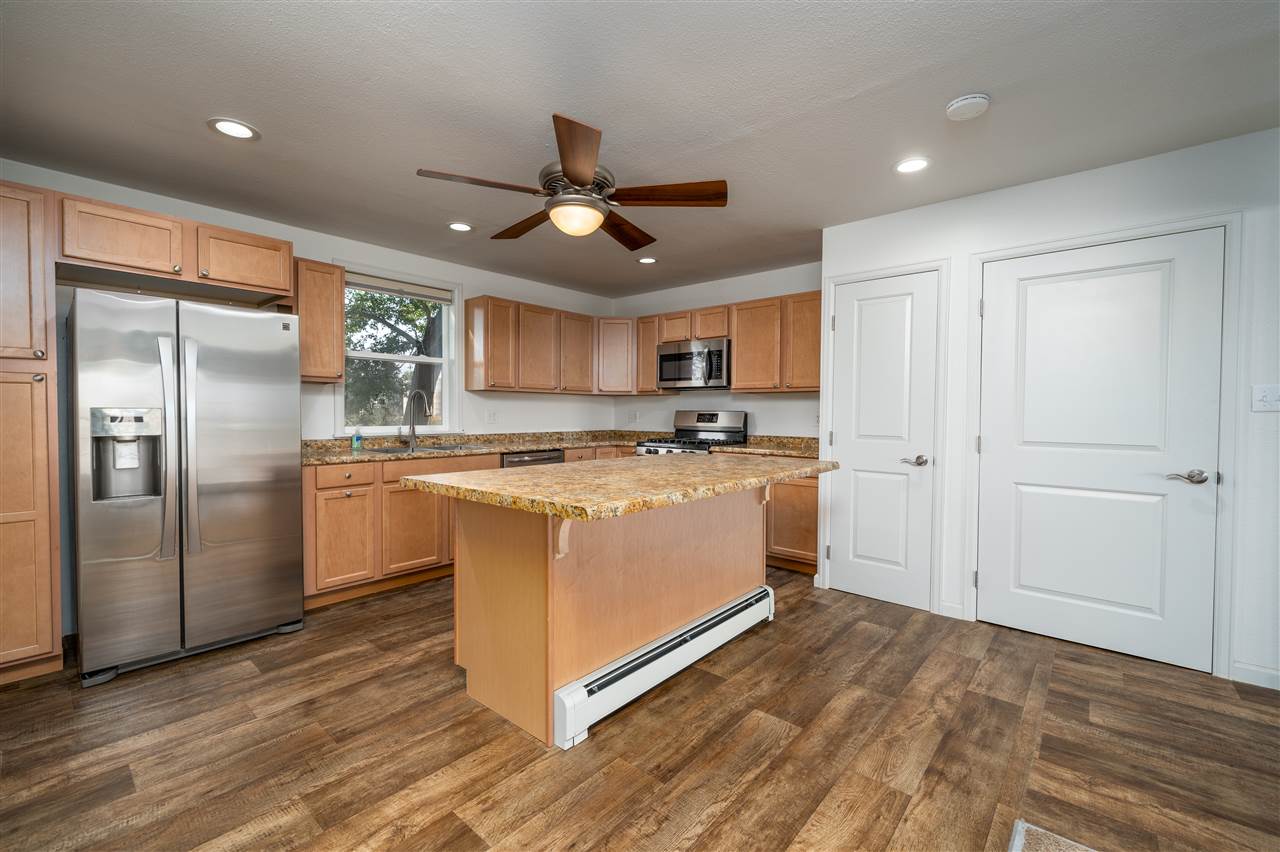 2052 I Road Fruita, CO 81521 - Photo 22 of 31 a kitchen with stainless steel appliances a refrigerator sink and microwave