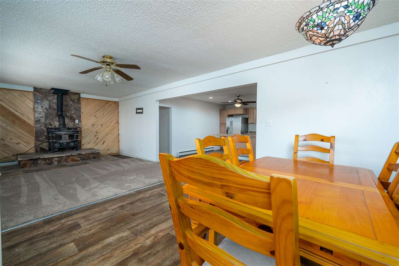 2052 I Road Fruita, CO 81521 - Photo 25 of 31 a bedroom with a bed and wooden floor