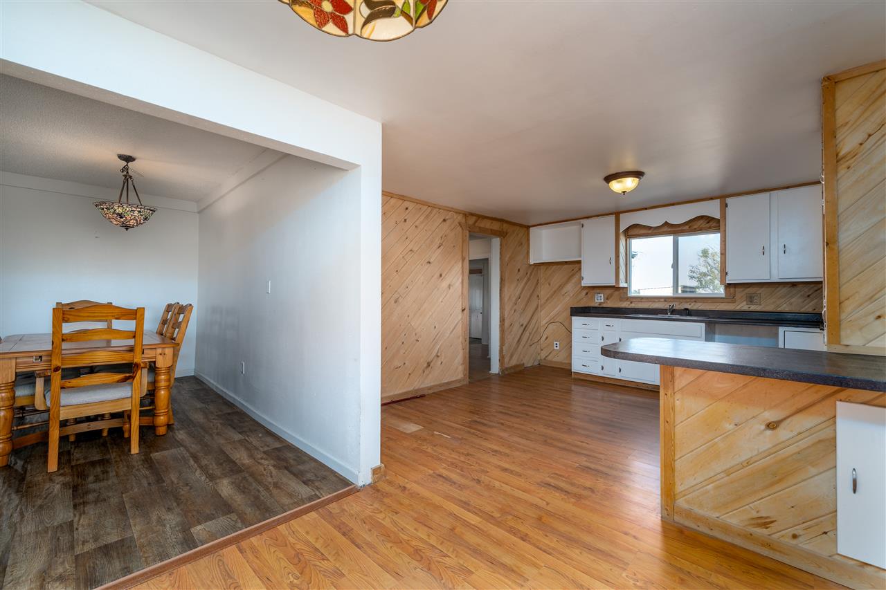 2052 I Road Fruita, CO 81521 - Photo 27 of 31 a view of kitchen with furniture and wooden floor