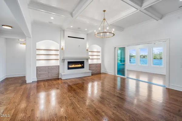 a view of interior space with wooden floor and windows