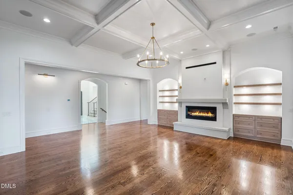 a view of an entryway with wooden floor and windows