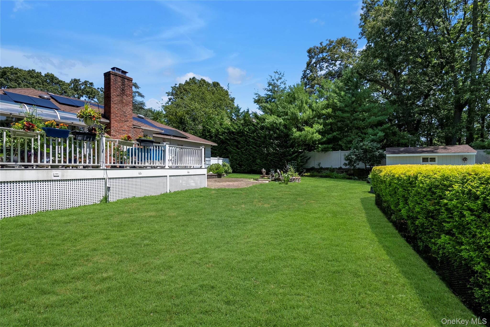 17 Melody Lane Bayville, NY 11709 - Photo 19 of 26 a front view of a house with garden