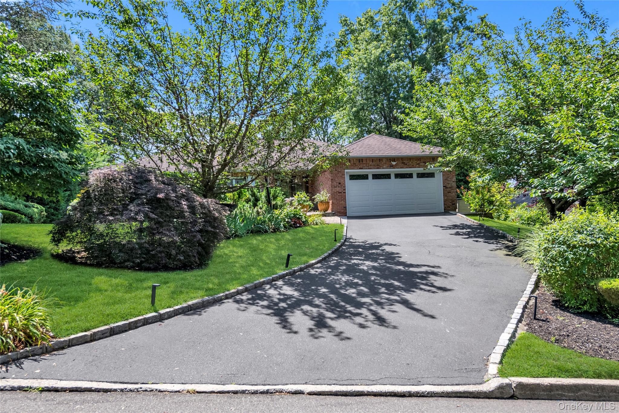 17 Melody Lane Bayville, NY 11709 - Photo 21 of 26 a front view of a house with a yard