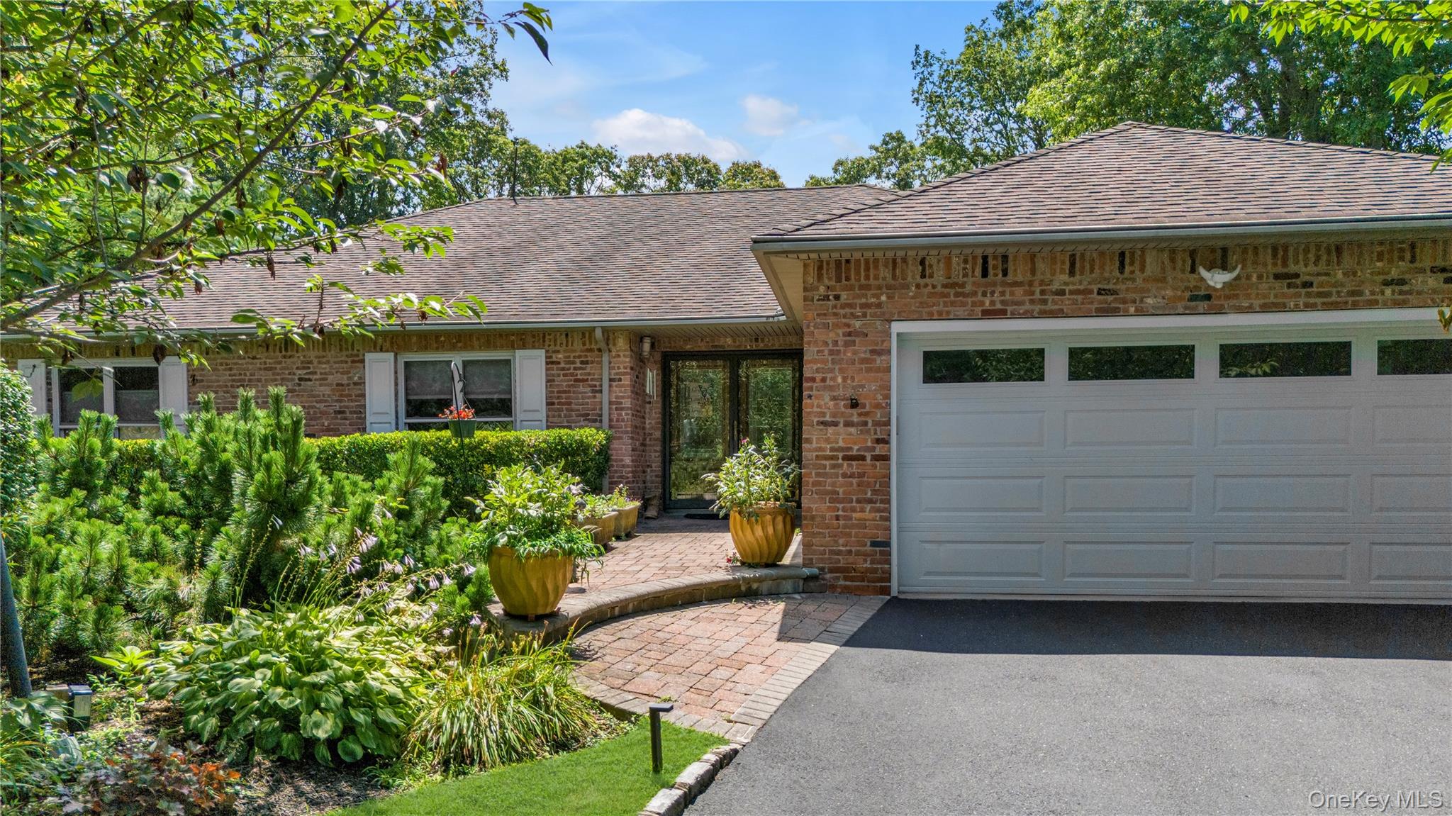 17 Melody Lane Bayville, NY 11709 - Photo 26 of 26 a front view of a house with a garden