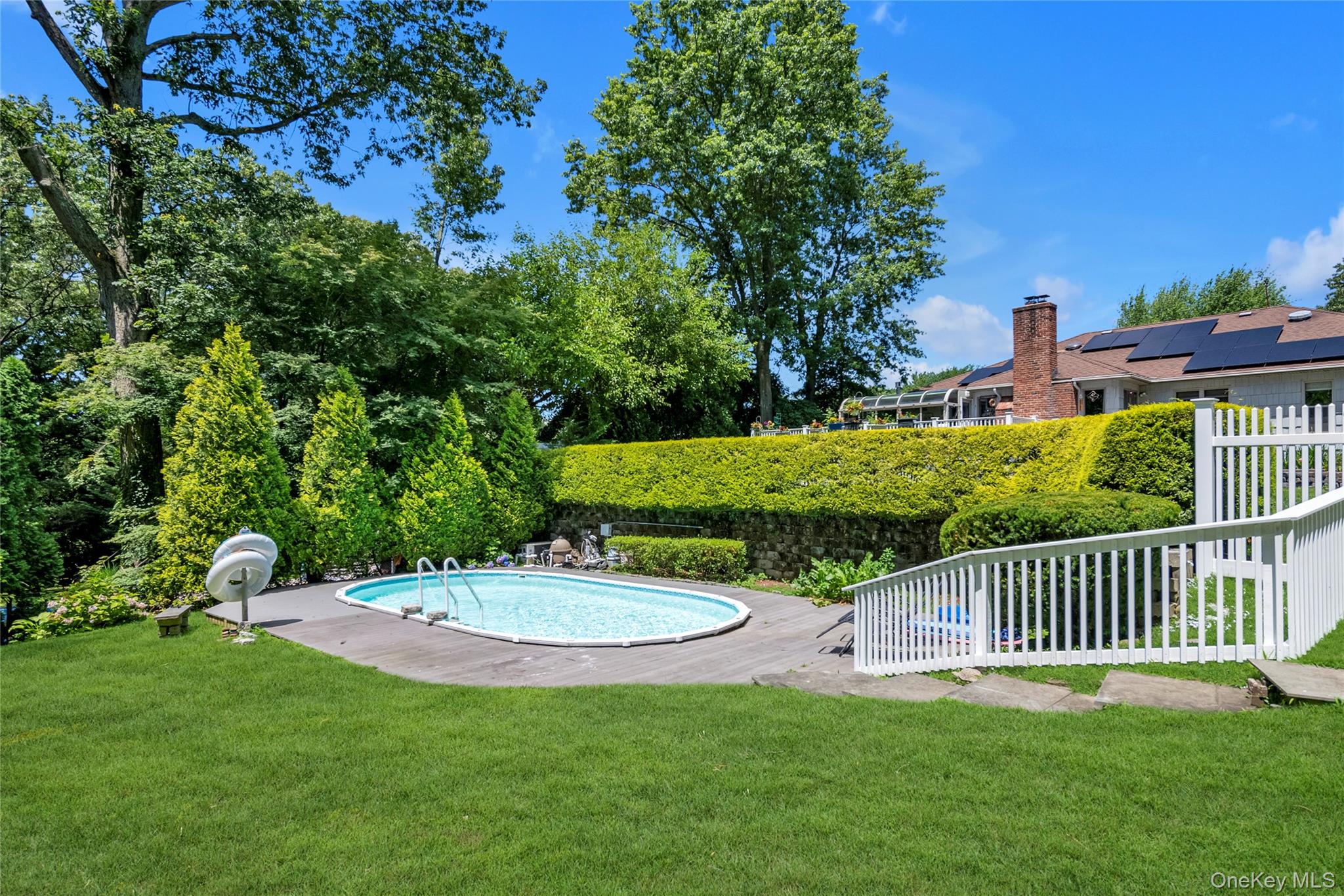 17 Melody Lane Bayville, NY 11709 - Photo 7 of 26 a view of a chair and table and the garden