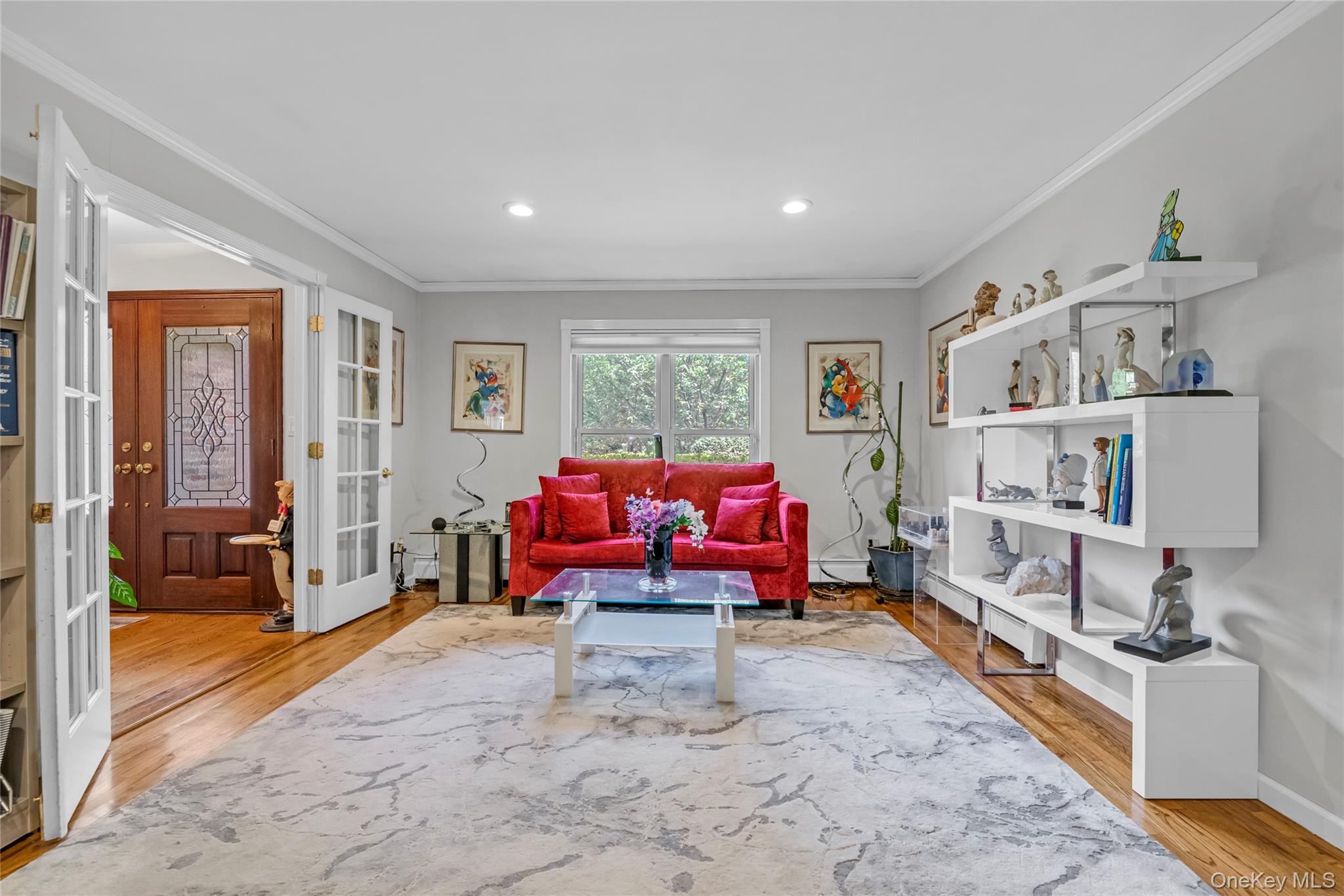 17 Melody Lane Bayville, NY 11709 - Photo 8 of 26 a living room with furniture and a flat screen tv