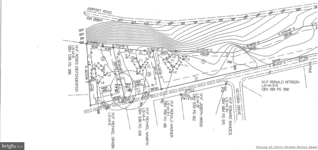 an aerial view of a residential houses with outdoor space