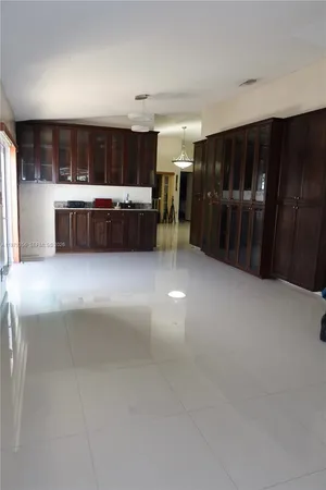 a kitchen with stainless steel appliances granite countertop a stove refrigerator and microwave