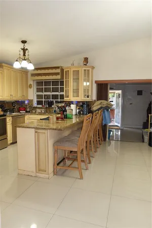 a kitchen with a table and chairs