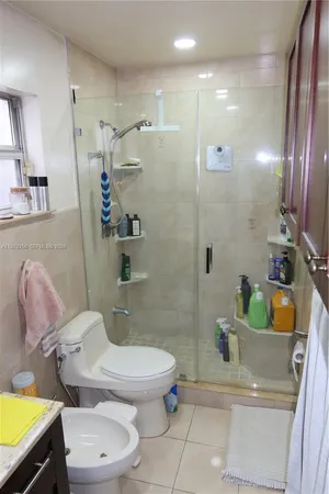 a view of a patio with table and chairs and potted plants