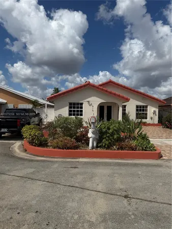 a house view with a backyard space