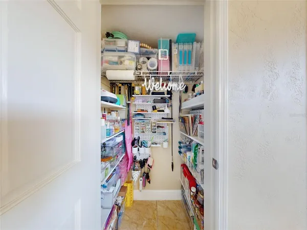 an aerial view of residential houses with outdoor space and street view