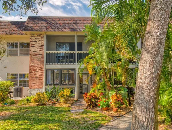 an aerial view of residential houses with outdoor space and swimming pool
