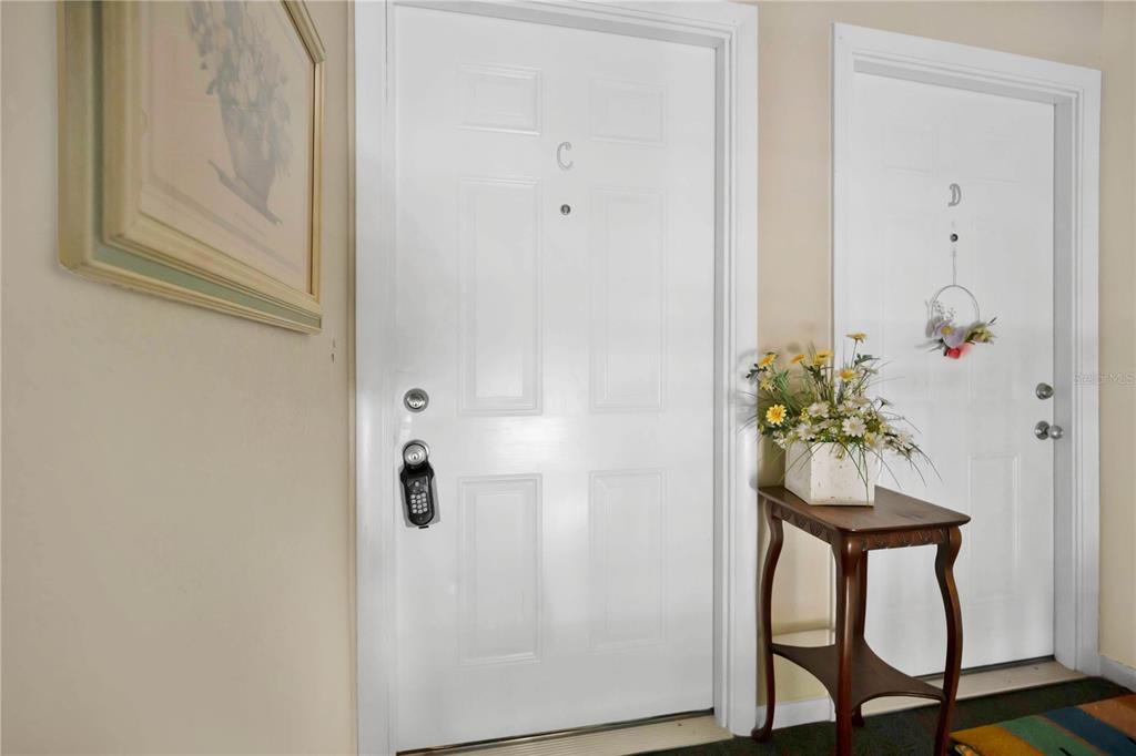 4262 Lake Underhill Road, Unit 9C7 Orlando, FL 32803 - Photo 12 of 22 a door with a table in it