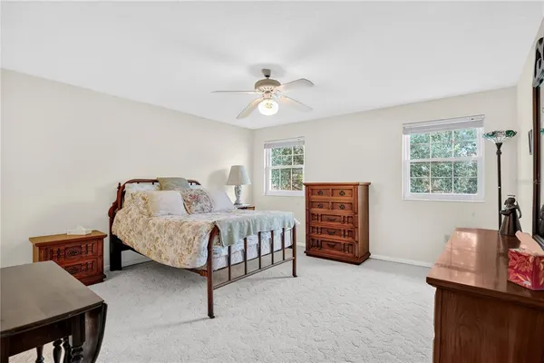 a bed room with a bed and a chandelier