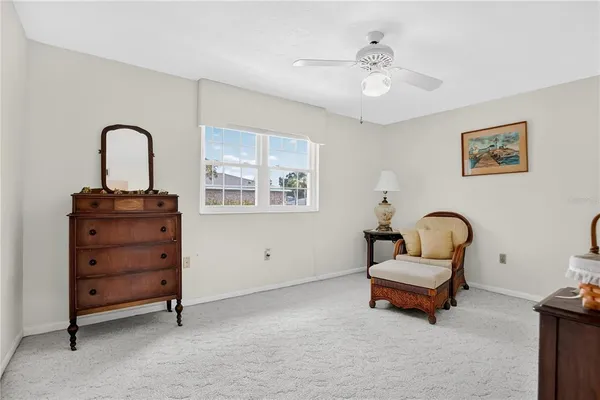 a living room with furniture and a piano