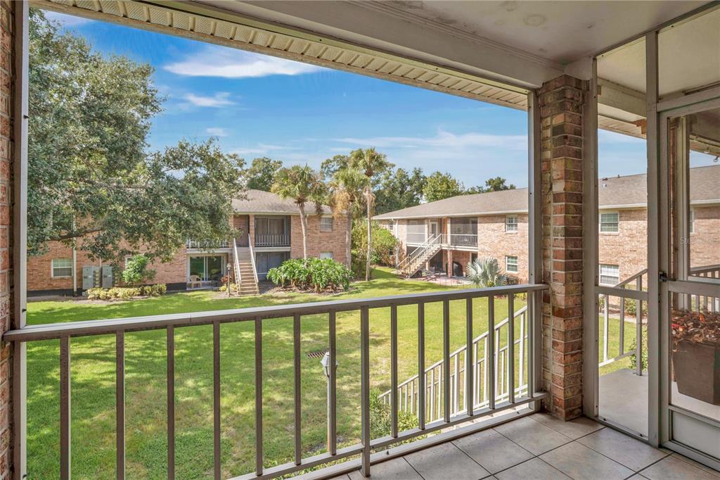 4262 Lake Underhill Road, Unit 9C7 Orlando, FL 32803 - Photo 19 of 22 a view of a building from a balcony