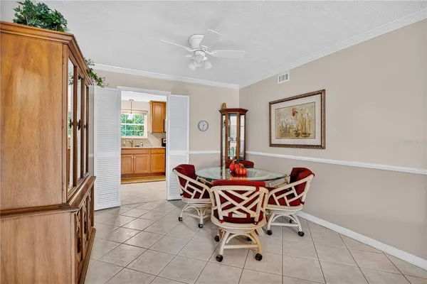 a dining room with furniture and window
