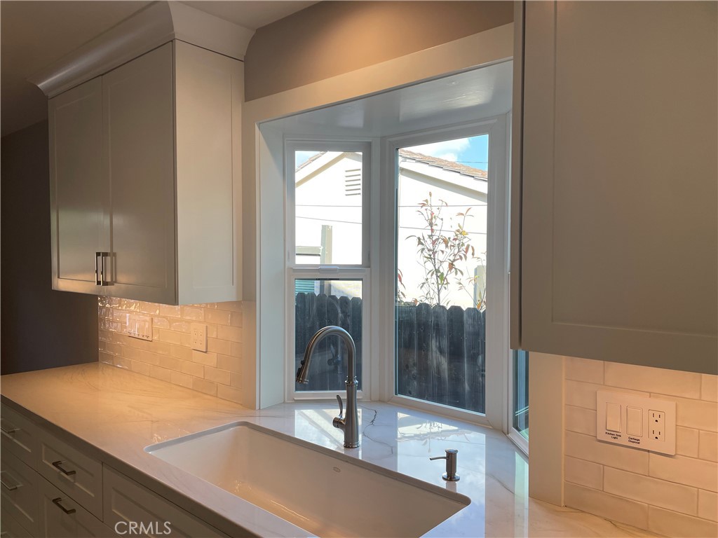 35 Ranchview Road Rolling Hills Estates, CA 90274 - Photo 12 of 35 a kitchen with a sink and a large mirror