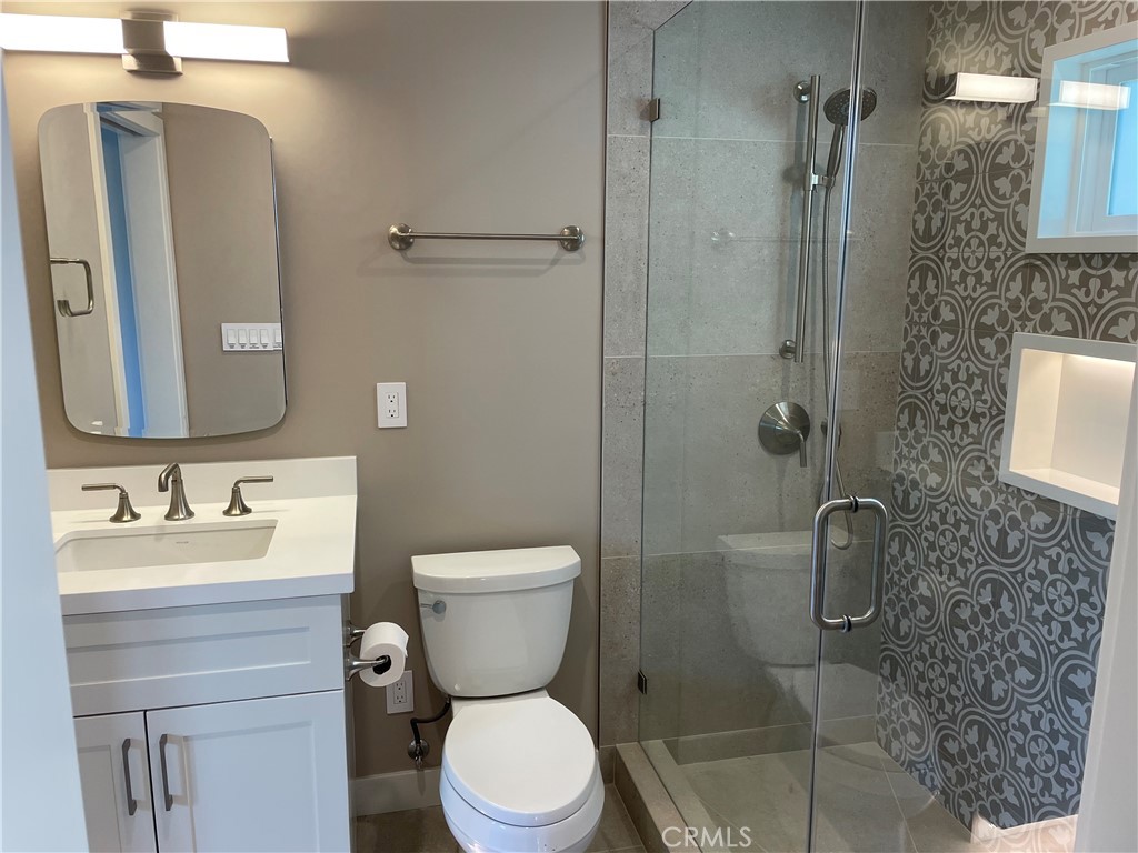 35 Ranchview Road Rolling Hills Estates, CA 90274 - Photo 15 of 35 a bathroom with a toilet sink shower and mirror