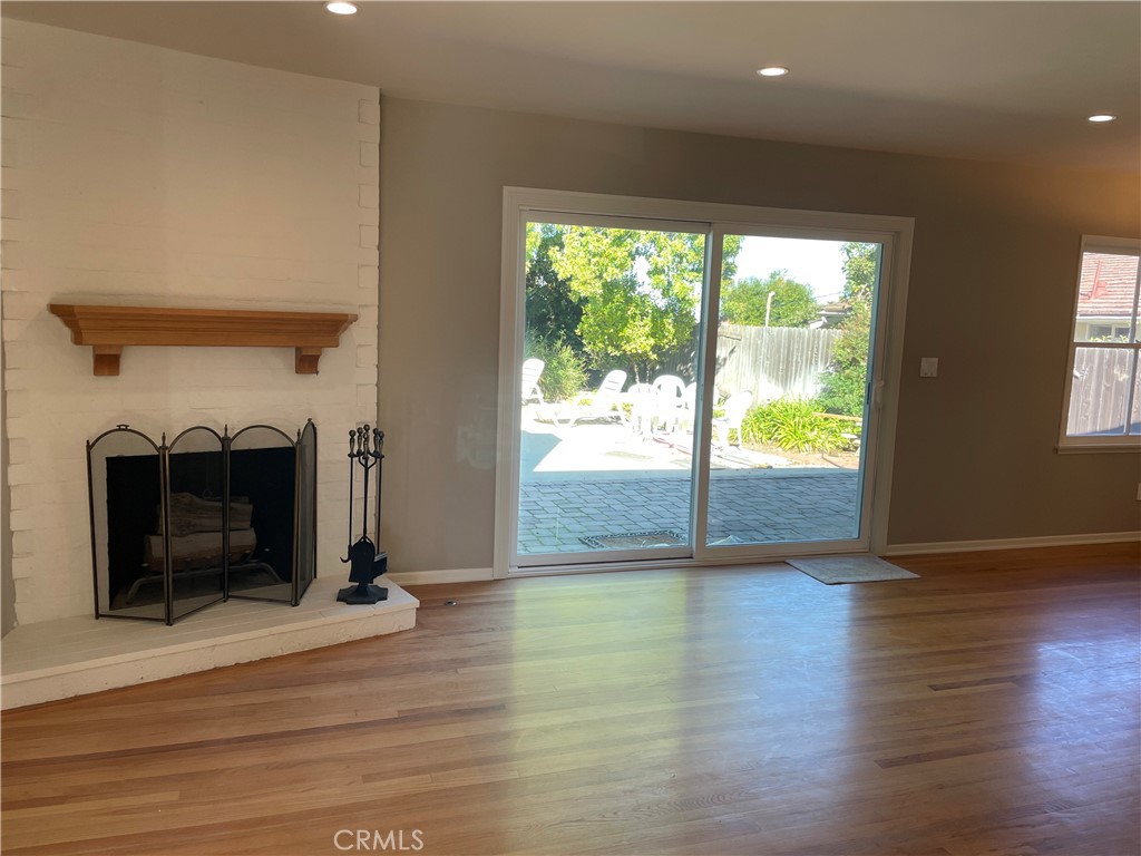 35 Ranchview Road Rolling Hills Estates, CA 90274 - Photo 18 of 35 a view of a livingroom with wooden floor and a fireplace