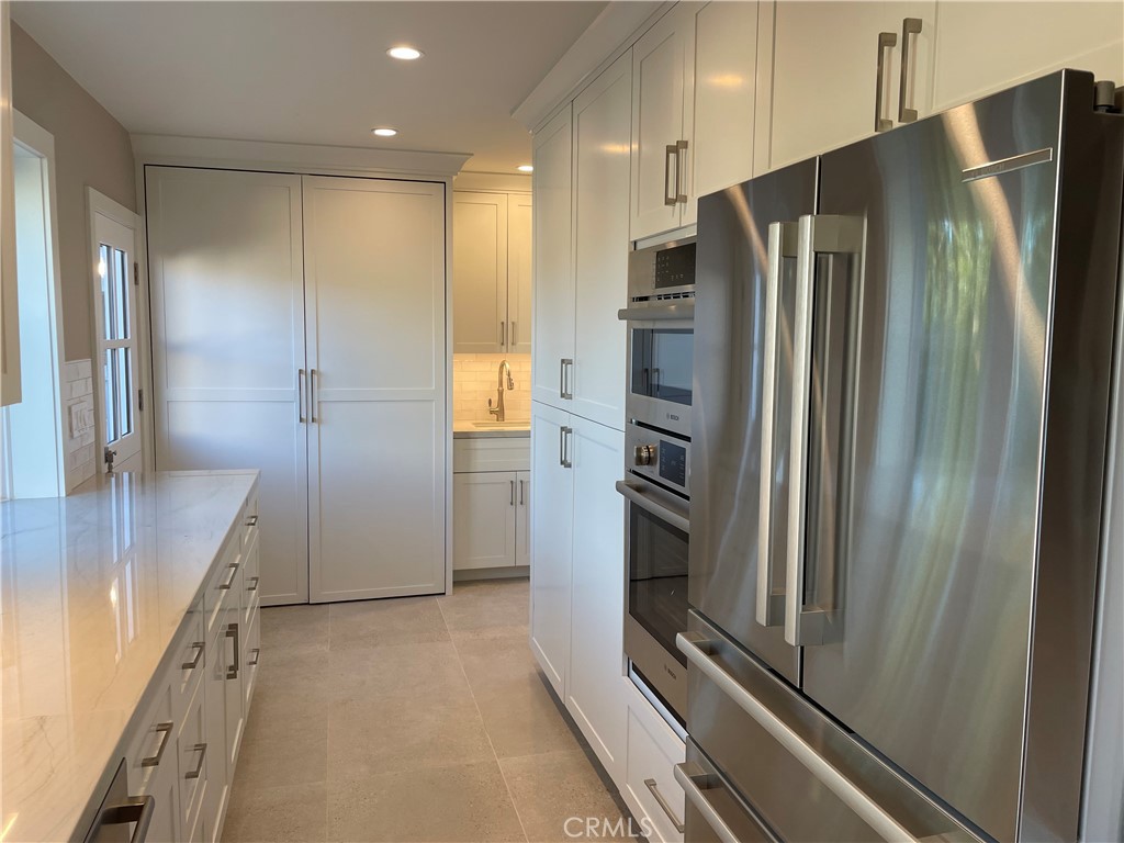 35 Ranchview Road Rolling Hills Estates, CA 90274 - Photo 21 of 35 a view of a refrigerator in kitchen and an empty room