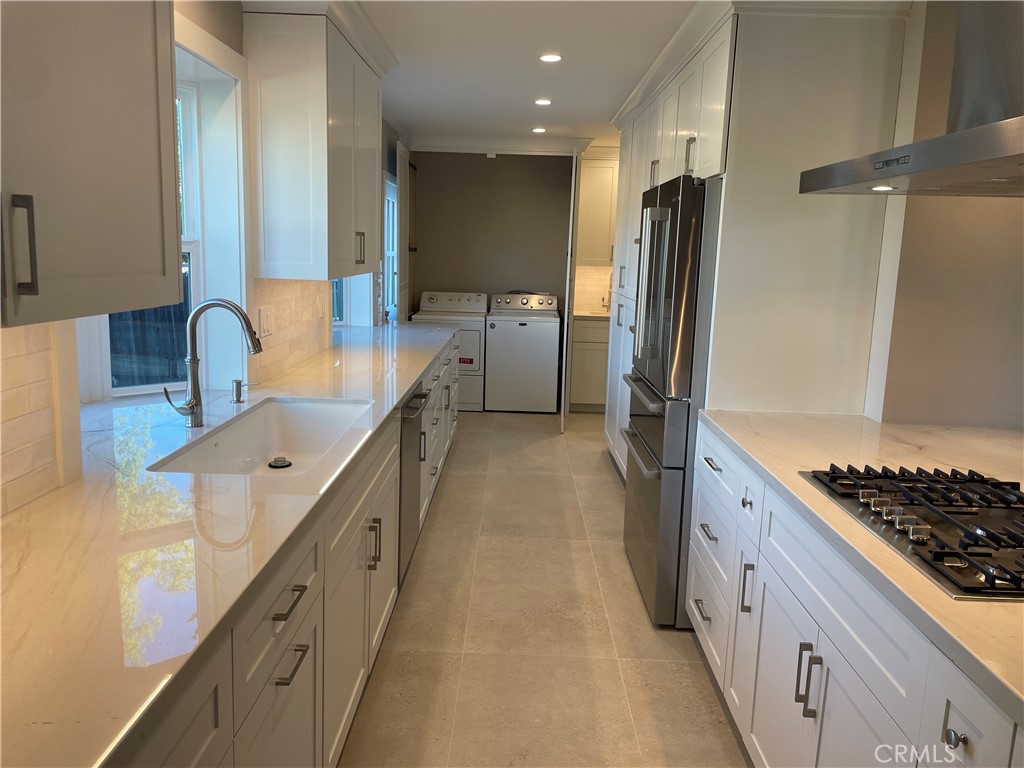 35 Ranchview Road Rolling Hills Estates, CA 90274 - Photo 22 of 35 a kitchen with stainless steel appliances granite countertop a sink stove and refrigerator