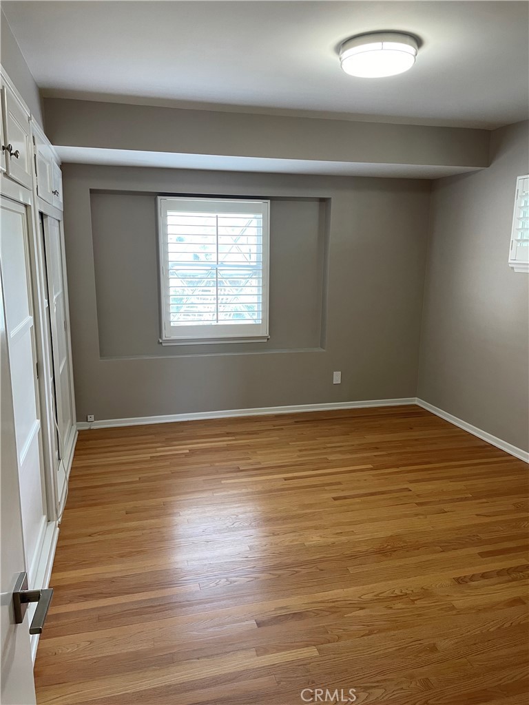 35 Ranchview Road Rolling Hills Estates, CA 90274 - Photo 7 of 35 a view of an empty room with wooden floor and a window