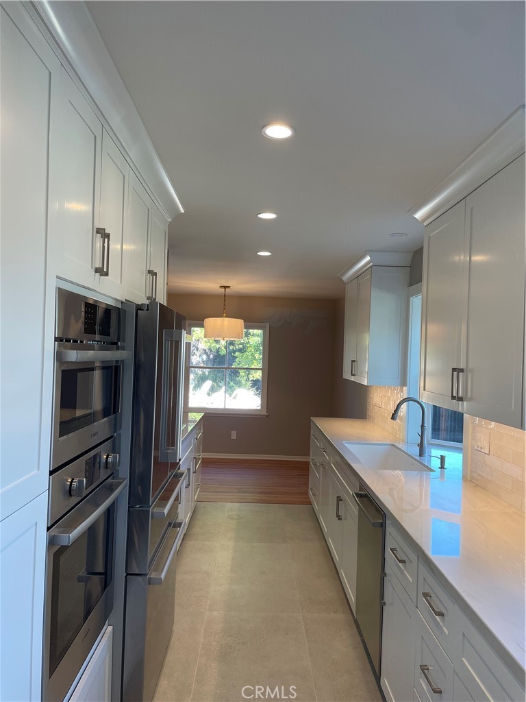 35 Ranchview Road Rolling Hills Estates, CA 90274 - Photo 10 of 35 a kitchen with stainless steel appliances a refrigerator sink and stove