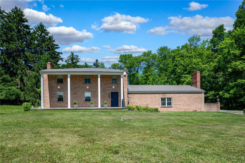 113 Iron Bridge Road Sarver, PA 16055 - Photo 1 of 49 a front view of a house with a garden