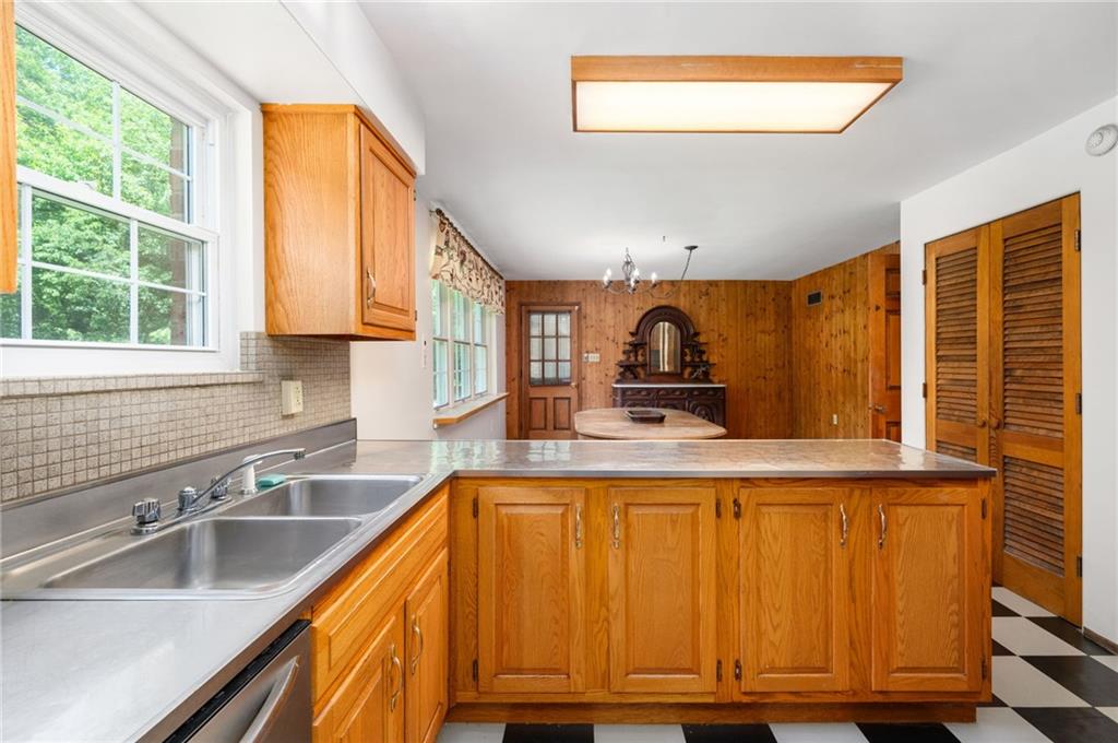 113 Iron Bridge Road Sarver, PA 16055 - Photo 18 of 49 a kitchen with wooden cabinets and a sink