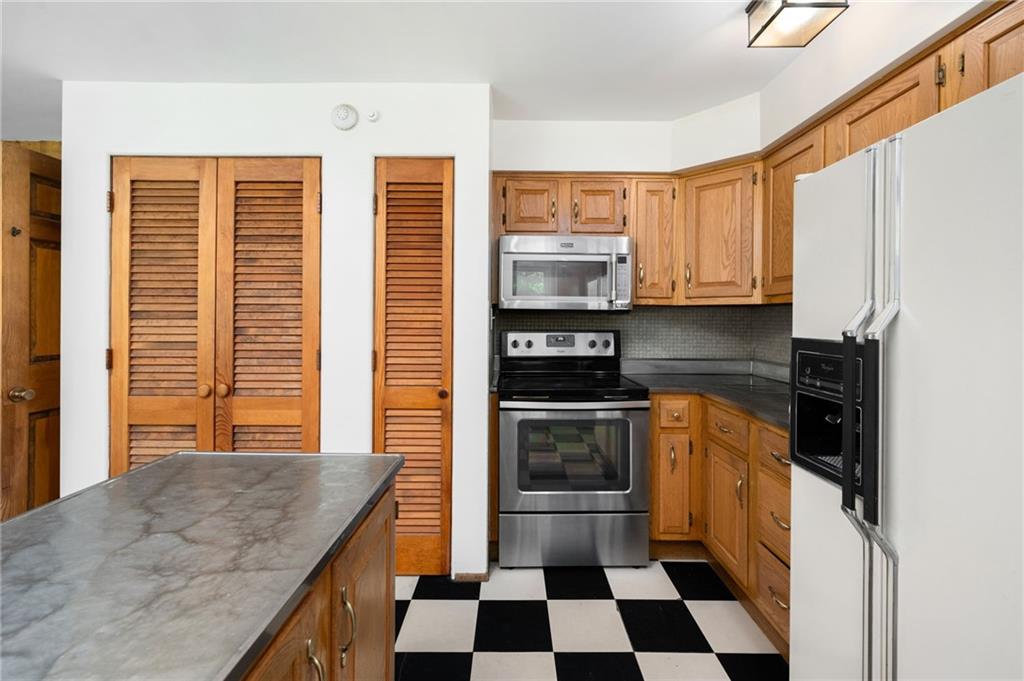 113 Iron Bridge Road Sarver, PA 16055 - Photo 19 of 49 a kitchen with stainless steel appliances granite countertop a stove a sink and a microwave