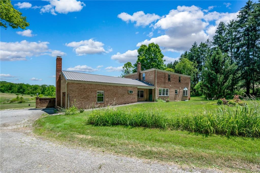 113 Iron Bridge Road Sarver, PA 16055 - Photo 44 of 49 a view of a house with backyard and garden