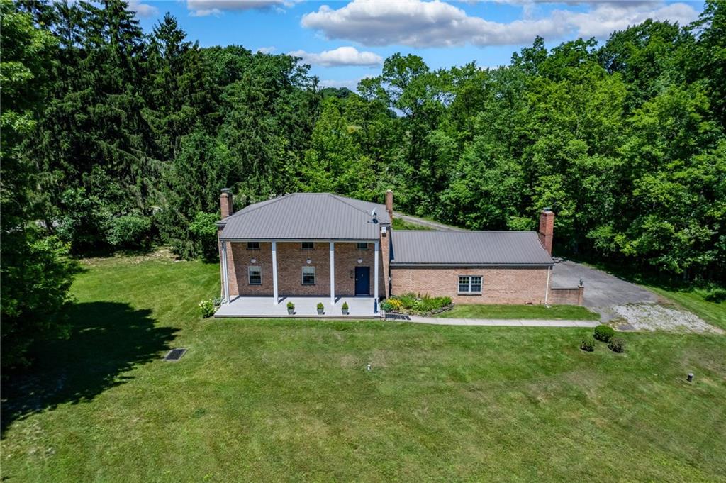113 Iron Bridge Road Sarver, PA 16055 - Photo 5 of 49 a front view of a house with a yard
