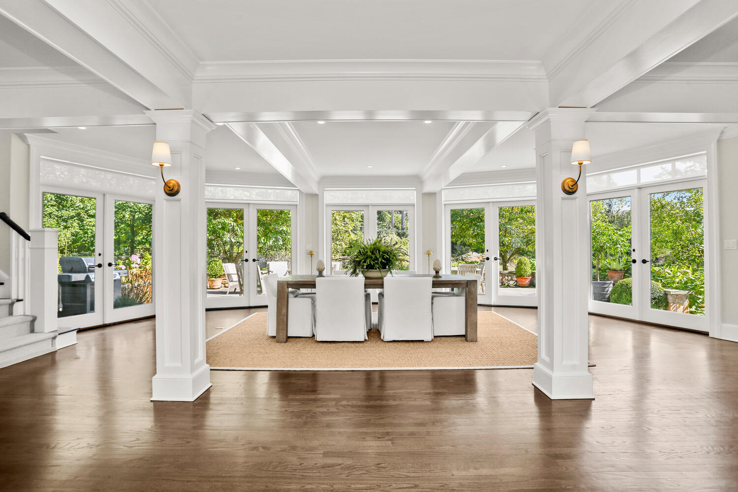 43 Contentment Island Road Darien, CT 06820 - Photo 13 of 59 a view of dining room with wooden floor and large windows