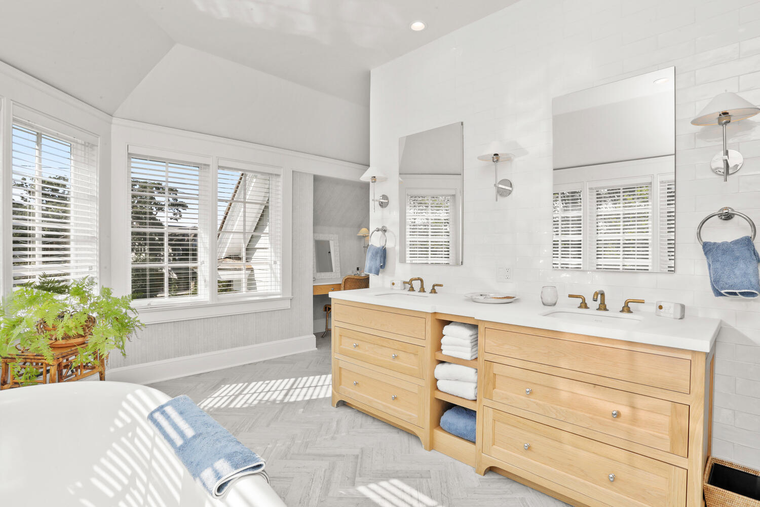 43 Contentment Island Road Darien, CT 06820 - Photo 26 of 59 a spacious bathroom with double vanity windows a double vanity and a bathtub