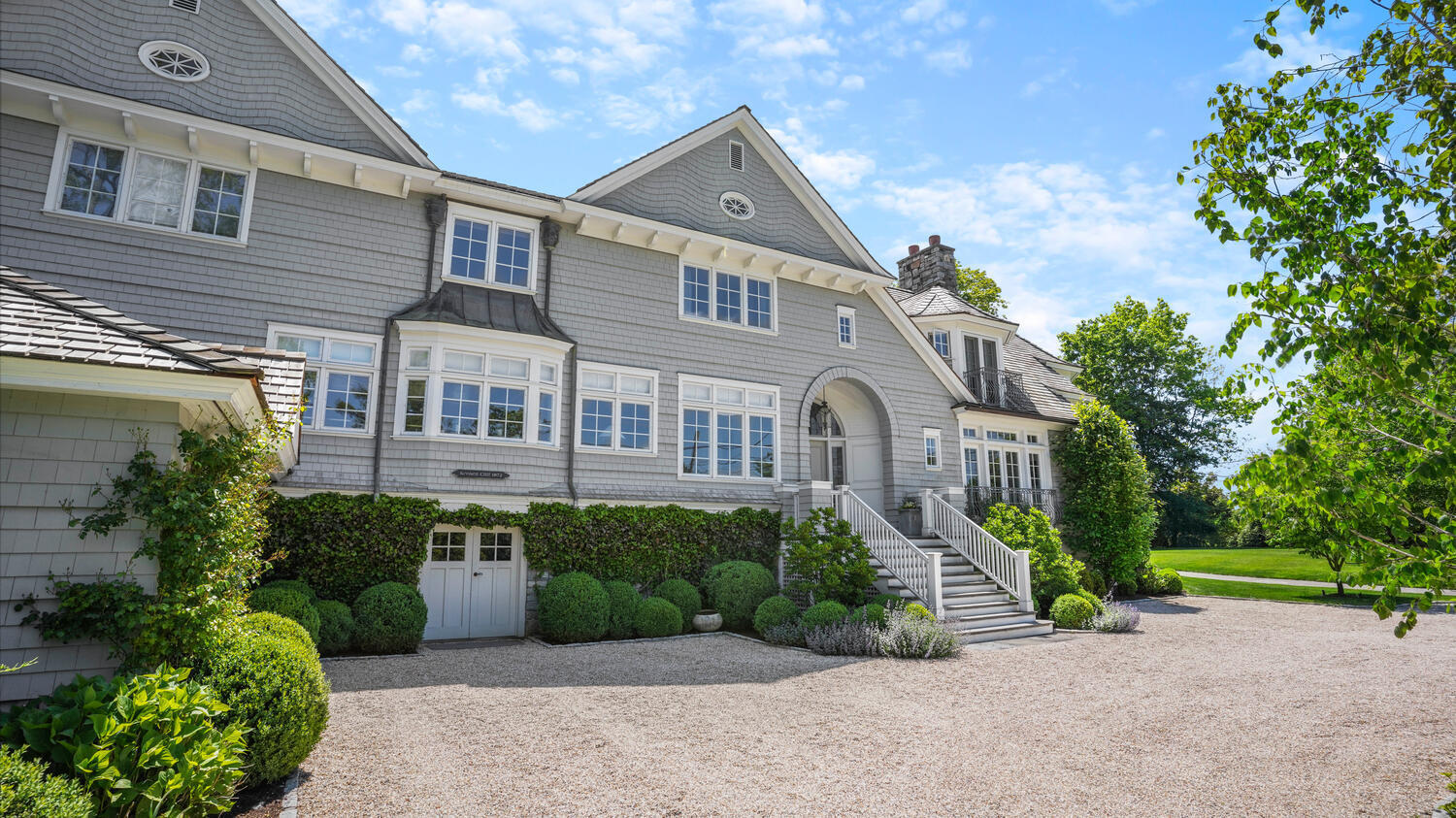43 Contentment Island Road Darien, CT 06820 - Photo 3 of 59 a front view of a house with garden