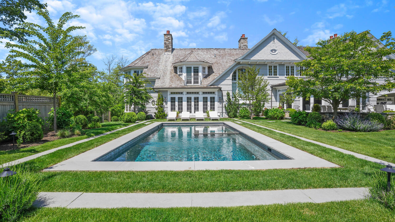 43 Contentment Island Road Darien, CT 06820 - Photo 37 of 59 a front view of a house with a yard