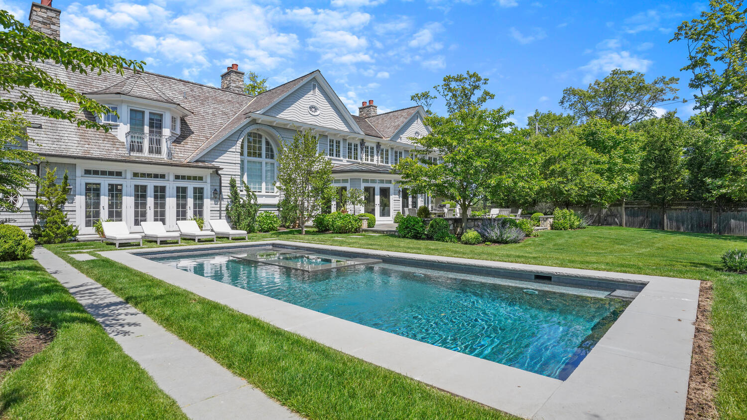 43 Contentment Island Road Darien, CT 06820 - Photo 38 of 59 a view of a house with a swimming pool