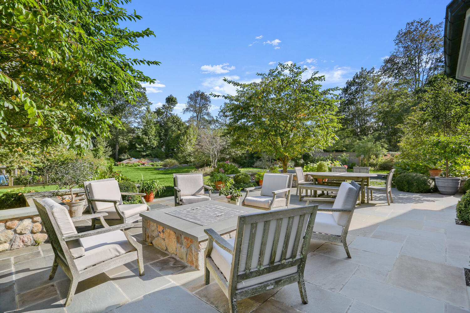 43 Contentment Island Road Darien, CT 06820 - Photo 39 of 59 a view of a patio with a table and chairs
