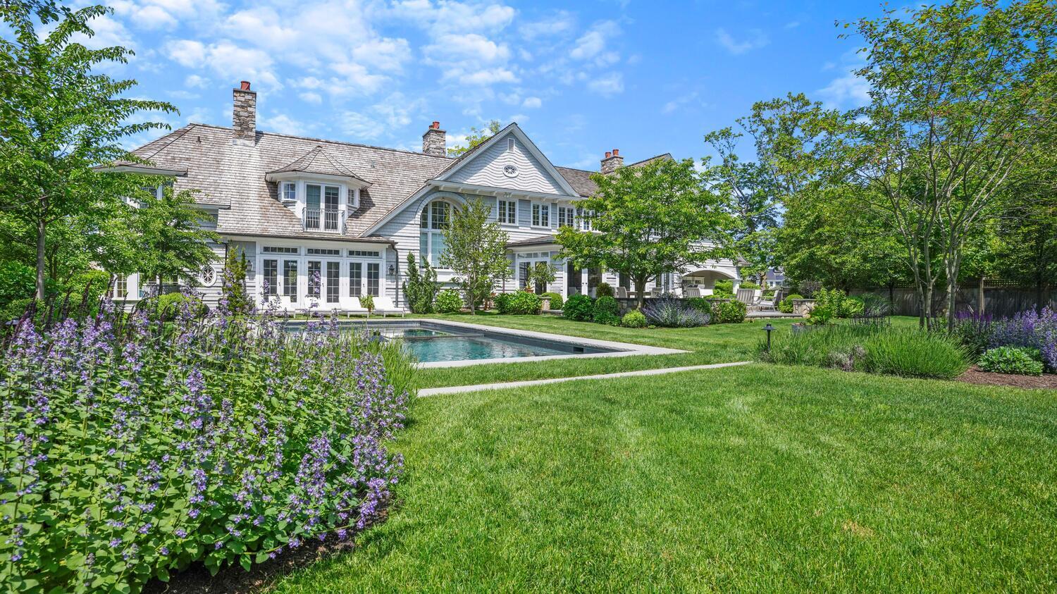 43 Contentment Island Road Darien, CT 06820 - Photo 41 of 59 a front view of a house with a yard