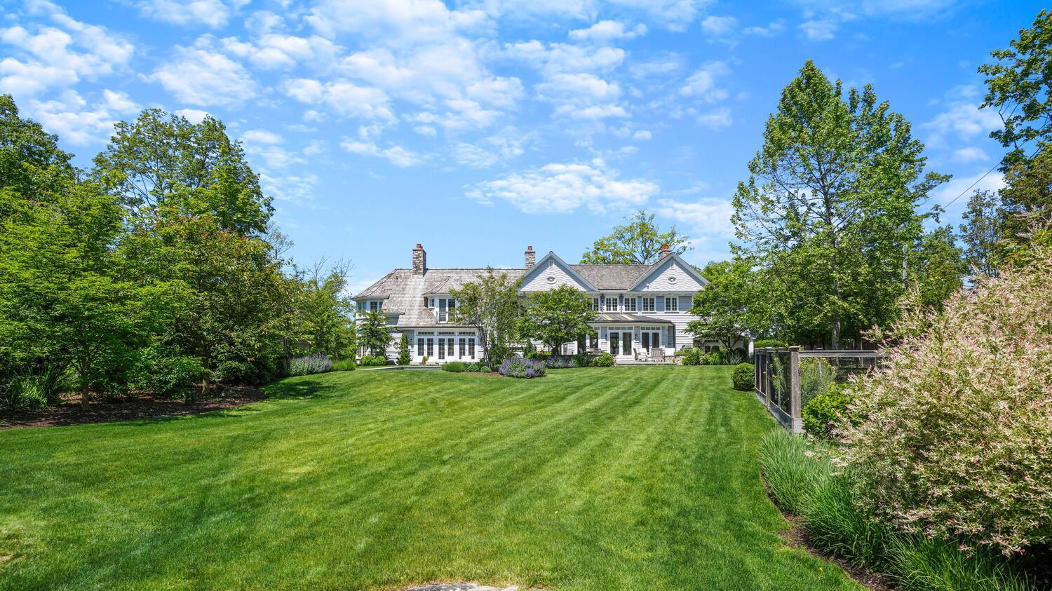 43 Contentment Island Road Darien, CT 06820 - Photo 42 of 59 a front view of a house with a yard