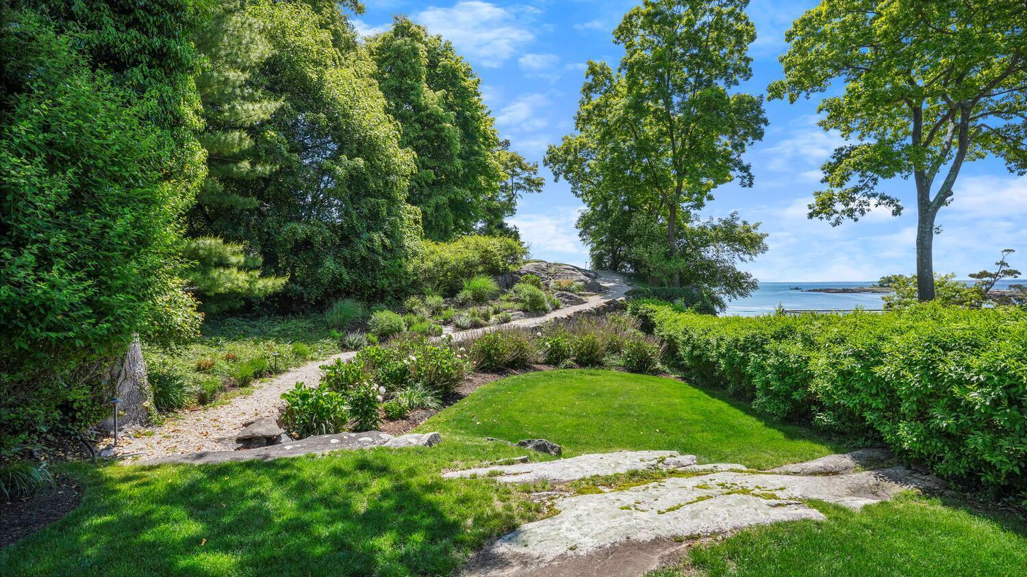 43 Contentment Island Road Darien, CT 06820 - Photo 45 of 59 a view of a garden with a building