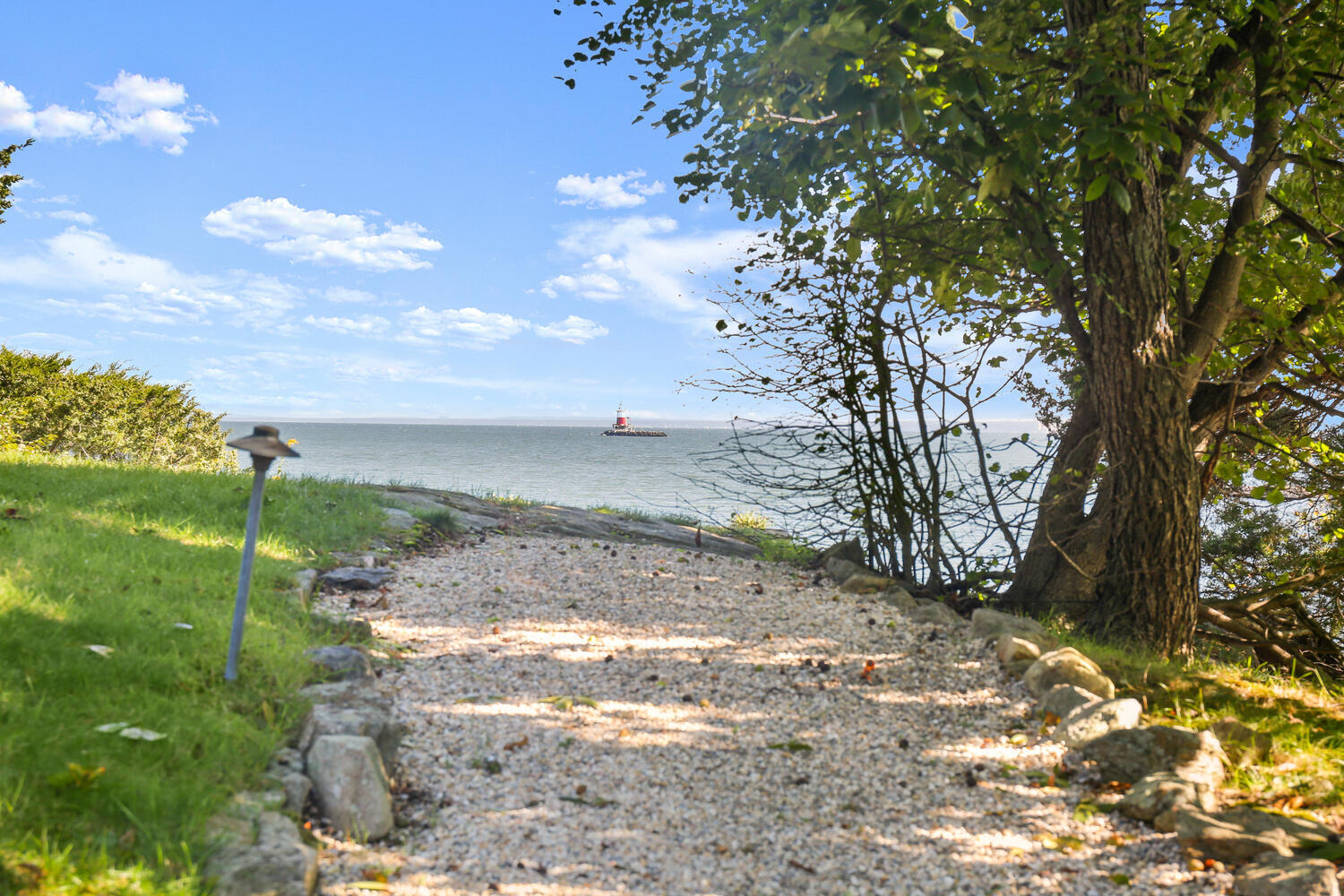43 Contentment Island Road Darien, CT 06820 - Photo 46 of 59 a view of a yard with an trees