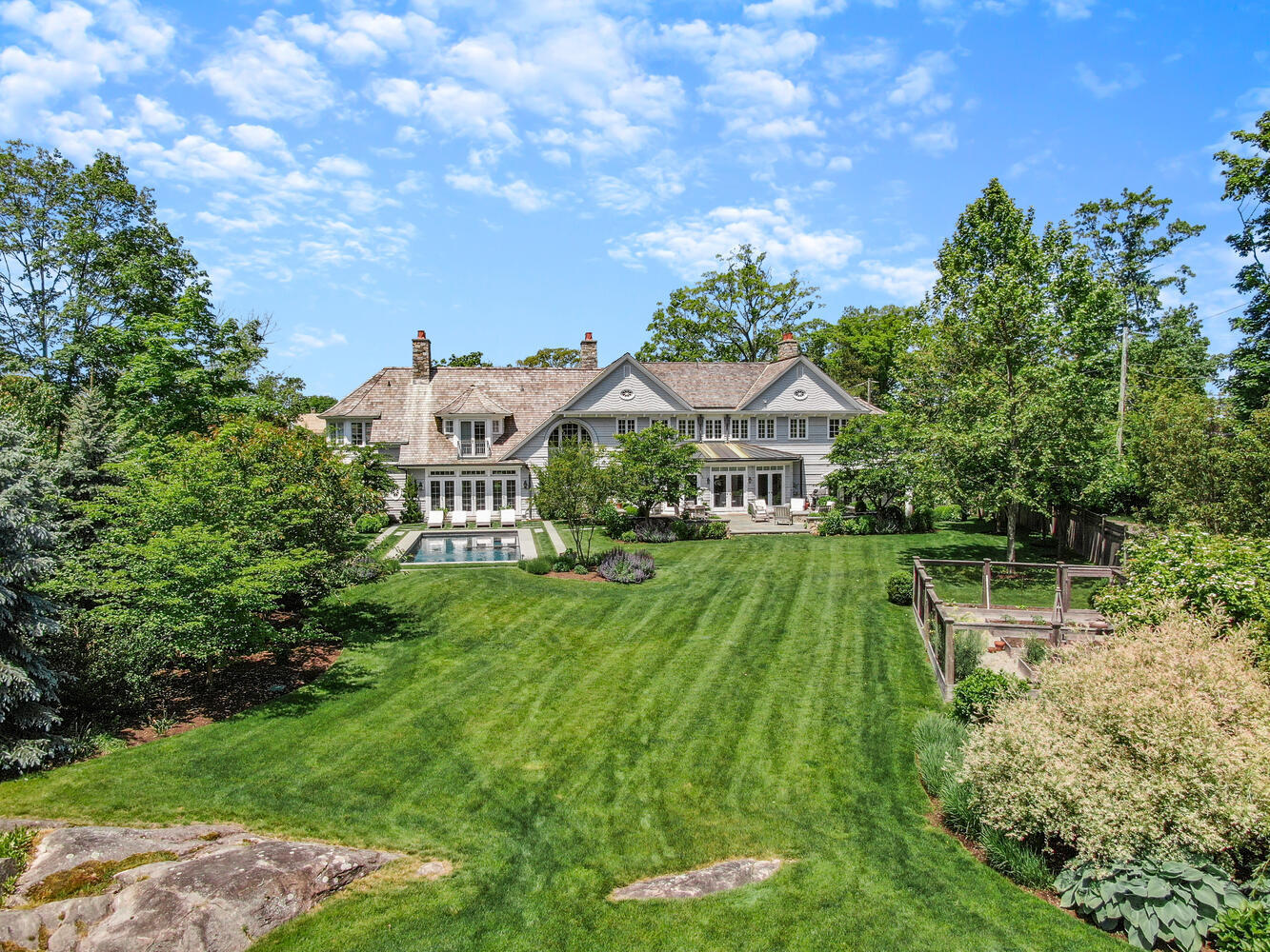 43 Contentment Island Road Darien, CT 06820 - Photo 54 of 59 a aerial view of a house with a yard table and chairs
